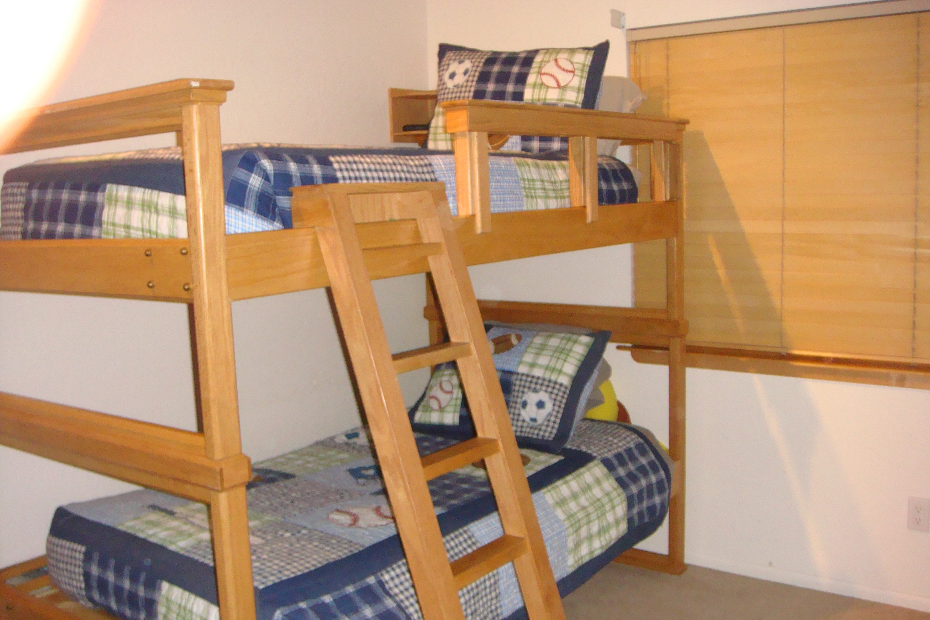 photo of bunk bed with the laddder and side rail