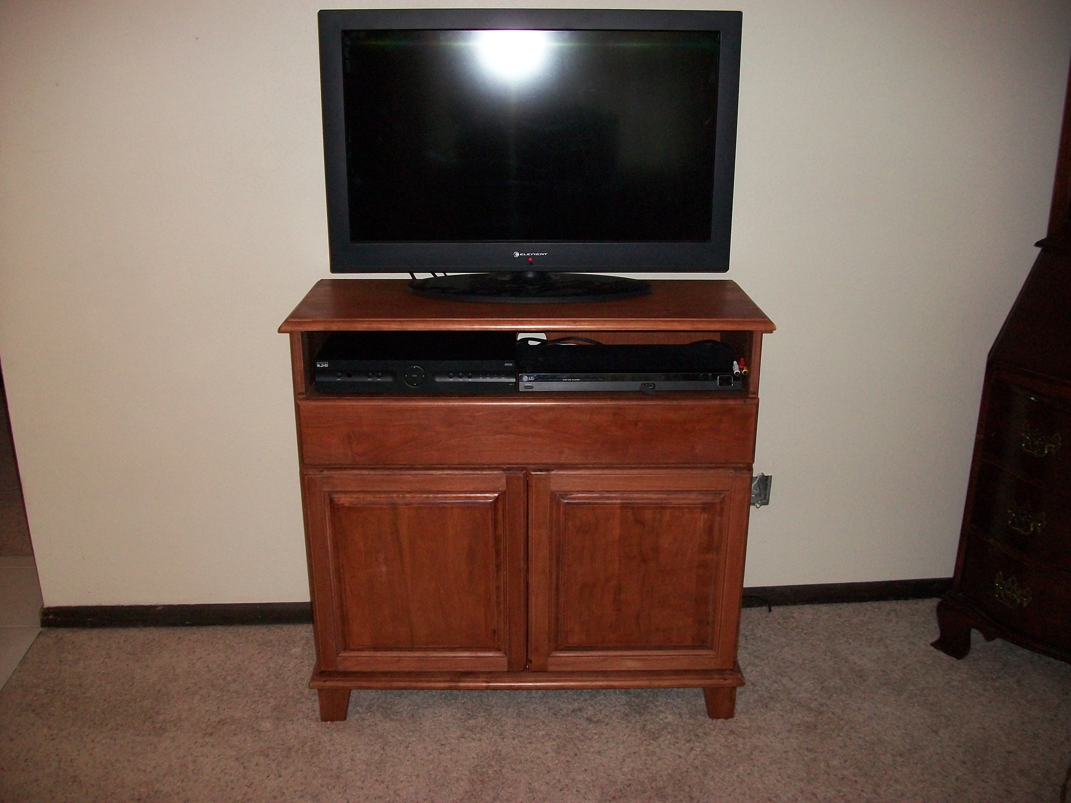 shows the cabinet from the front with drawer and doors open