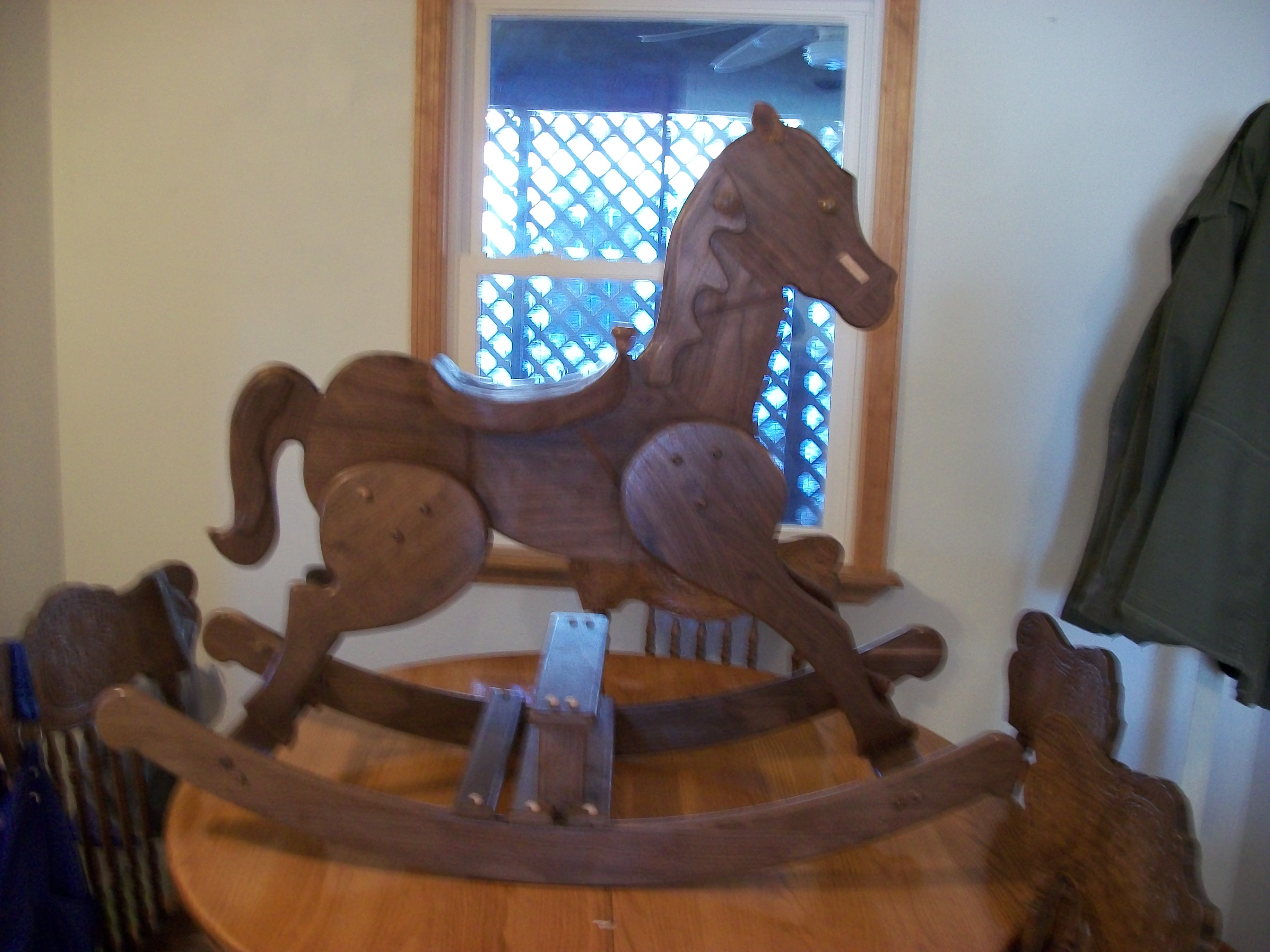 Rocking Horse is made of walnut. It's  made to resemble a Carousel horse. 